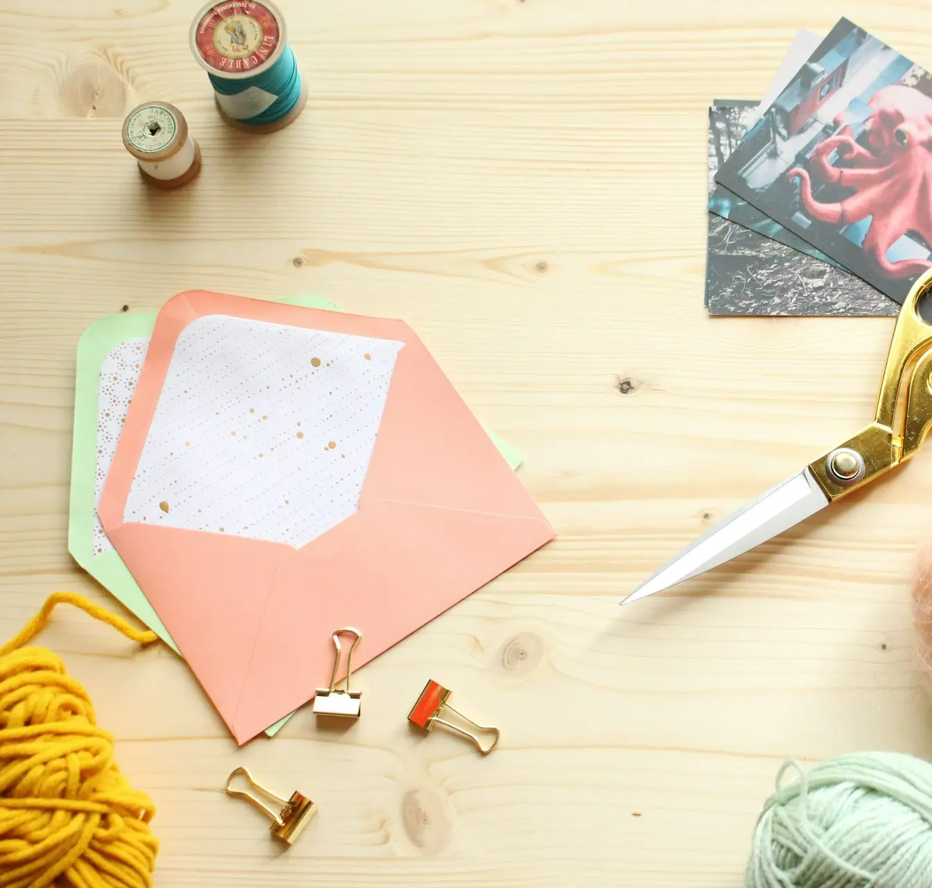 silver scissors on pink paper